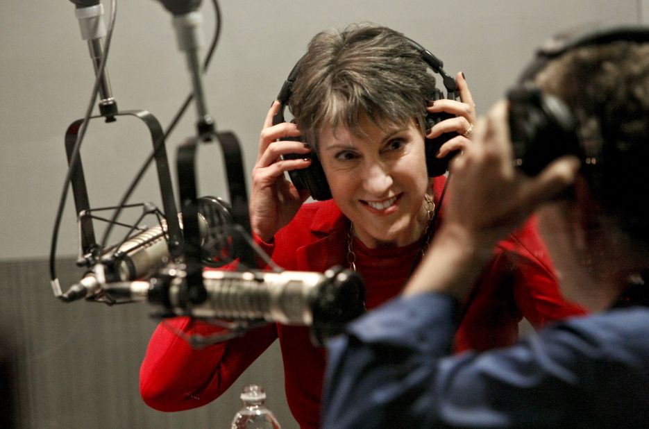 Fiorina, left, puts on headphones before participating in a radio debate with incumbent U.S. Sen. Barbara Boxer, D-California, in Washington, as co-moderator Gabriel Lerner, metro editor of La Opinion, does the same at local public-radio affiliate KPCC studios September 29, 2010, in Pasadena, California. 