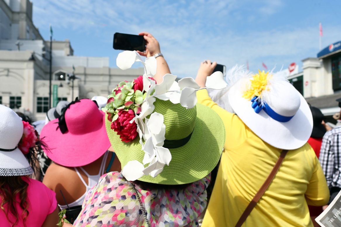 Hats, dresses and patterns adorn Churchill Downs for Derby - Louisville  Business First