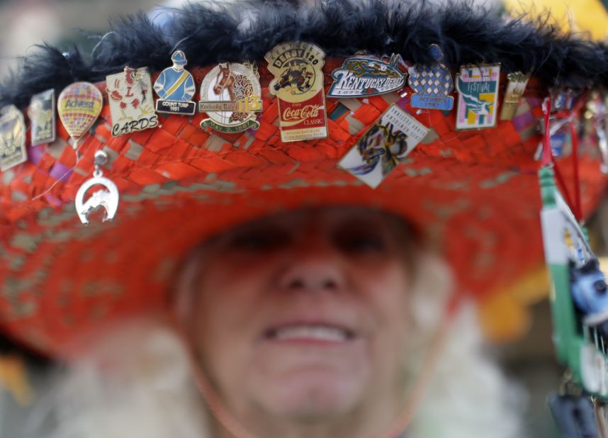 Ginny Keen adorned her hat with festive pins. While she's at the Derby, many hat makers were at parties around the country, vying for prizes for creativity.