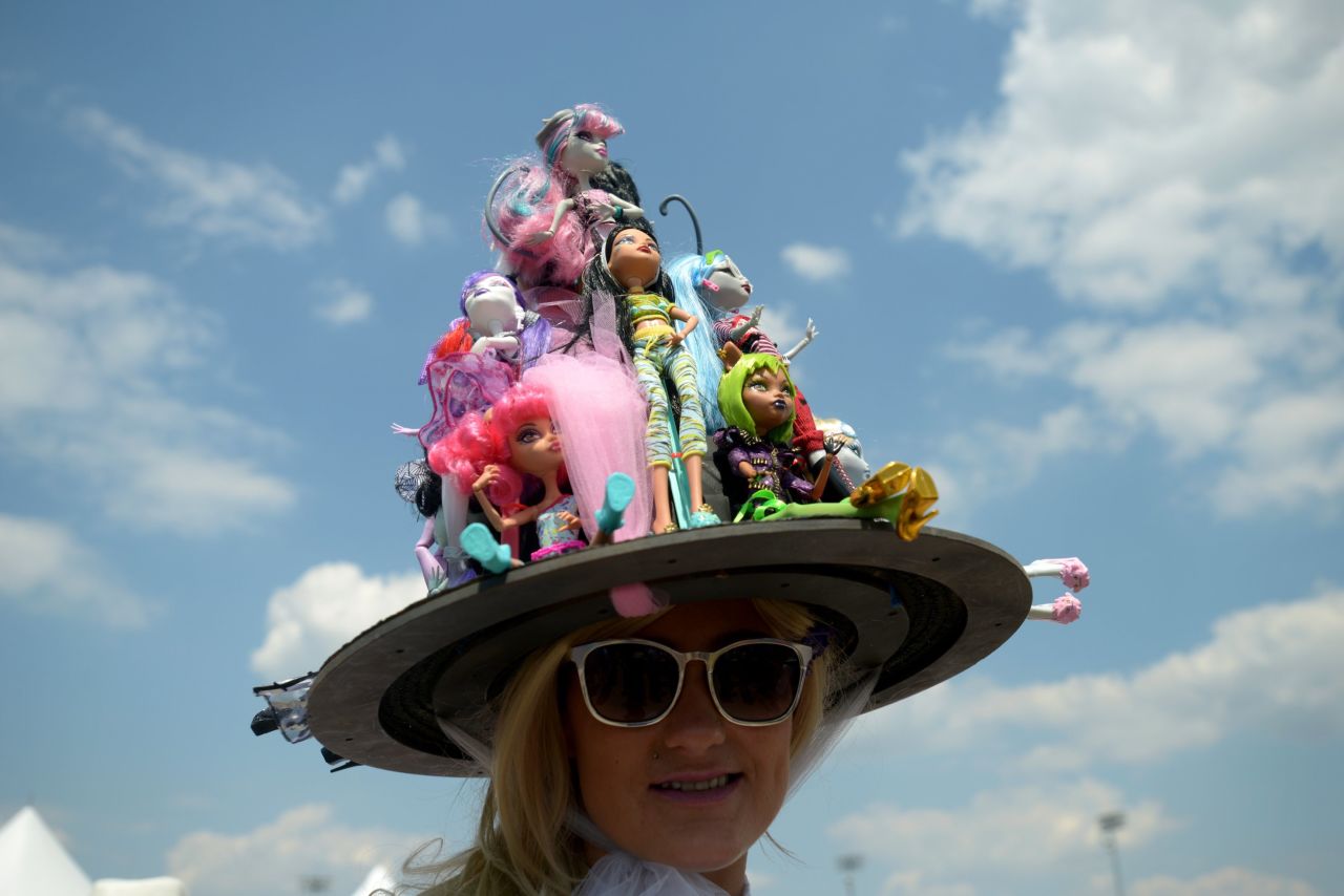 A collection of dolls makes up the decorations on this unique hat at the 141st running of the Kentucky Derby at Churchill Downs on Saturday, May 2, in Louisville. 