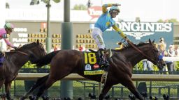Victor Espinoza rides American Pharoah to victory in the 141st running of the Kentucky Derby horse race at Churchill Downs Saturday, May 2, 2015, in Louisville, Ky. (AP Photo/Morry Gash)
