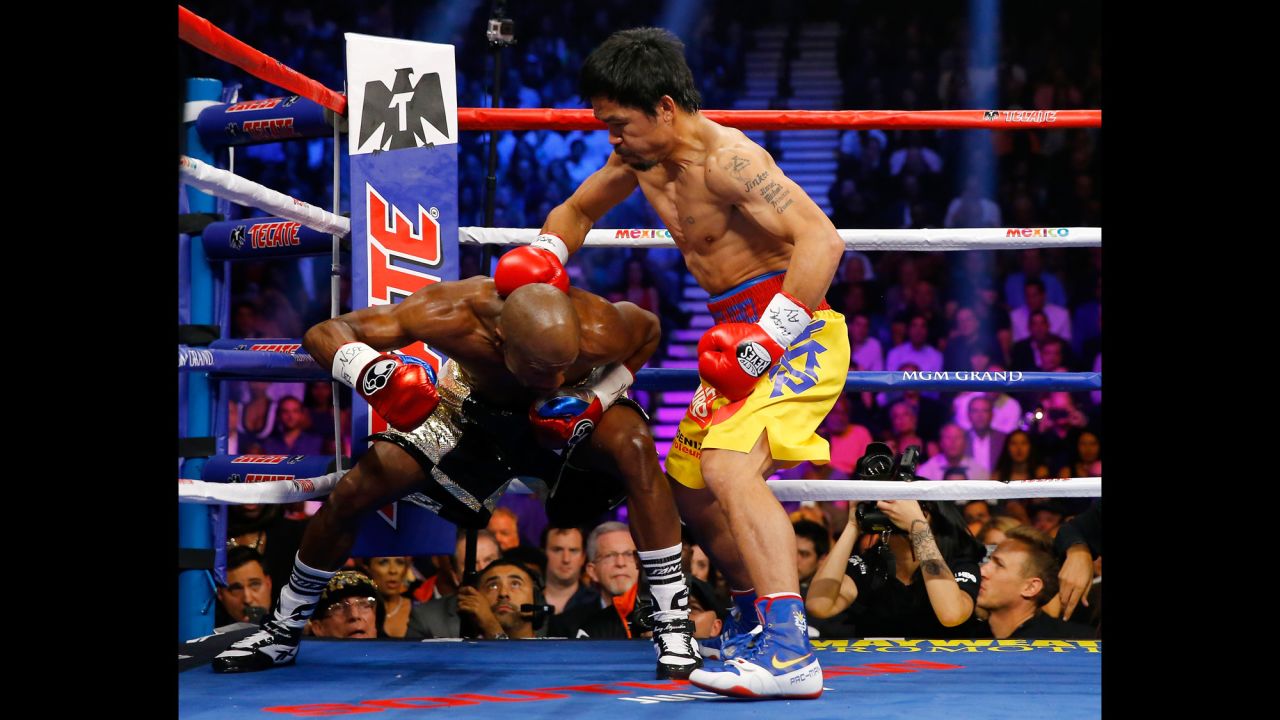 Manny Pacquiao throws a right at Floyd Mayweather on Saturday, May 2.