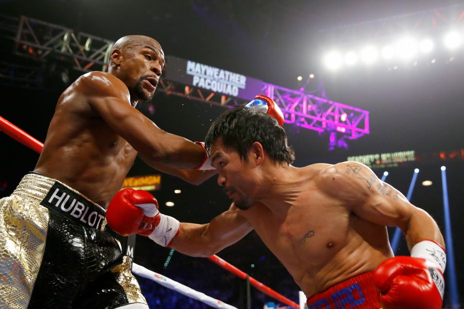 Floyd Mayweather and Manny Pacquiao exchange punches on Saturday, May 2, at their championship fight in Las Vegas.