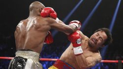 Floyd Mayweather Jr. and Manny Pacquiao exchange blows.