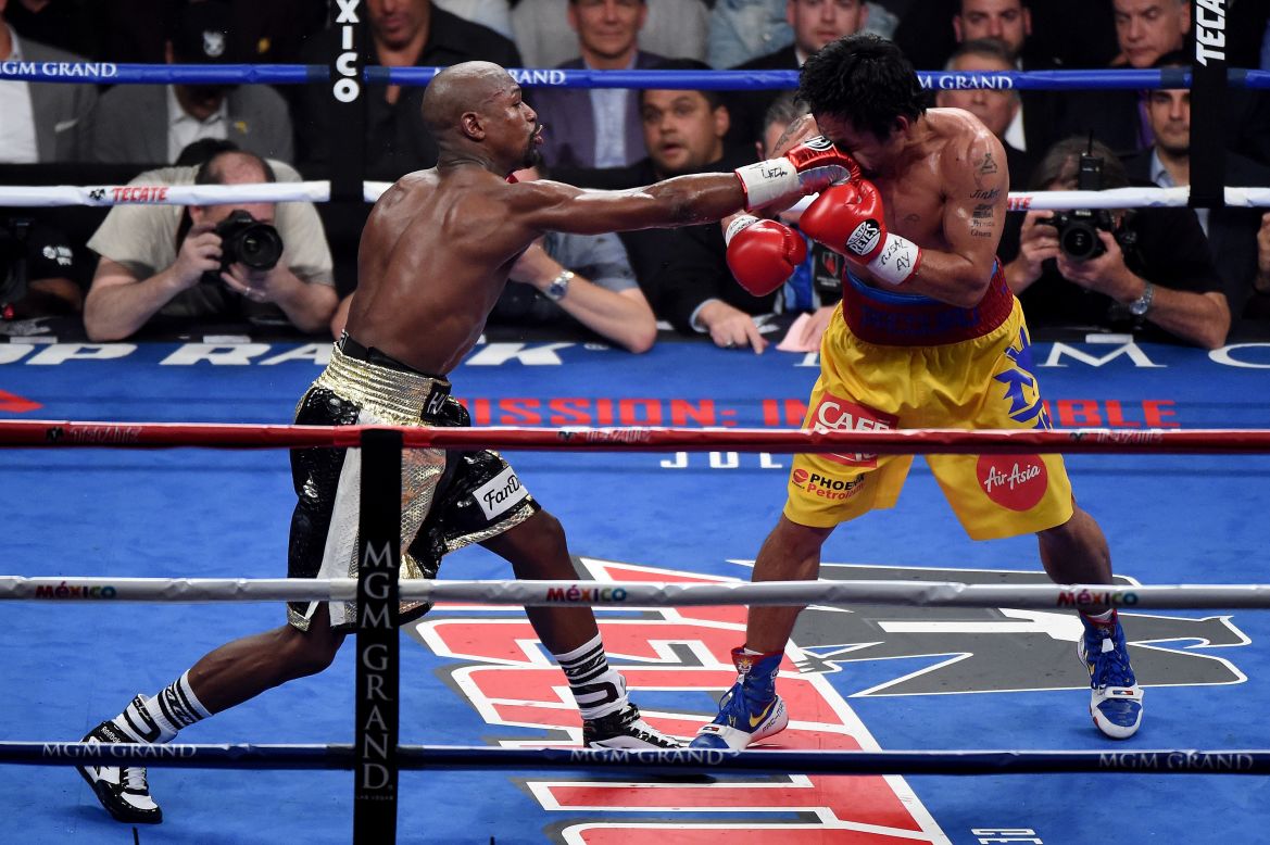 Floyd Mayweather, who looked strong late, connects during the 12-round fight.