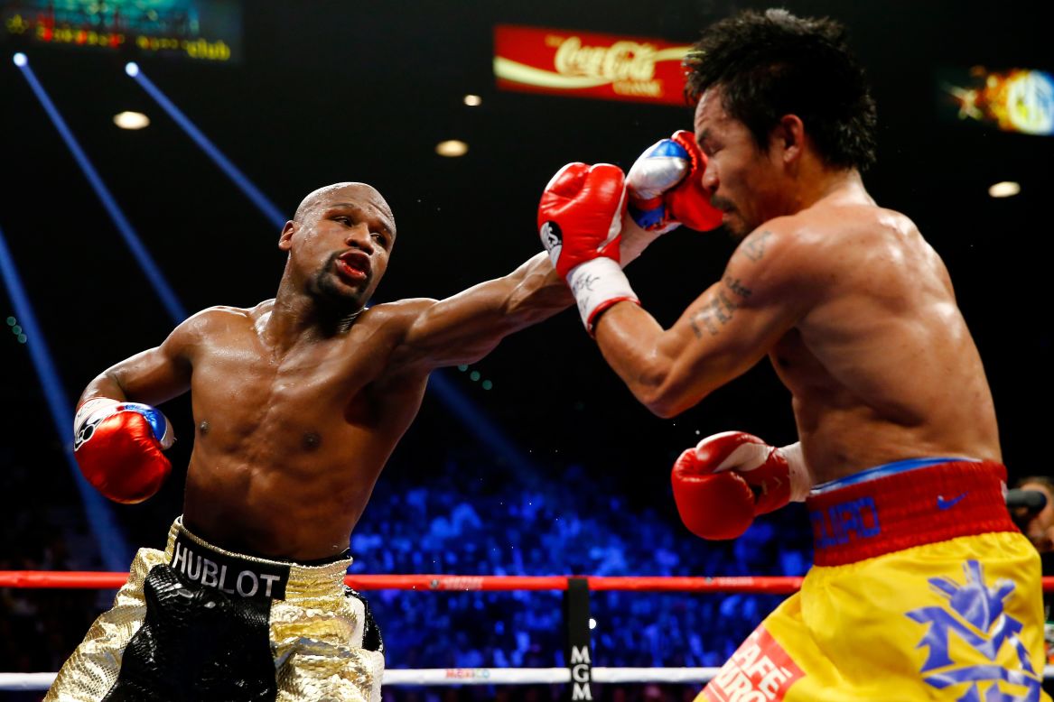 Floyd Mayweather throws a nasty left at Manny Pacquiao. 