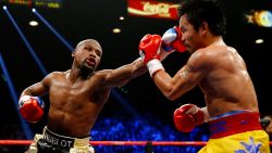 Floyd Mayweather Jr. throws a left at Manny Pacquiao. 