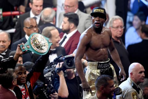 Floyd Mayweather won the World Boxing Organization's title and retained the World Boxing Association and World Boxing Council belts. 