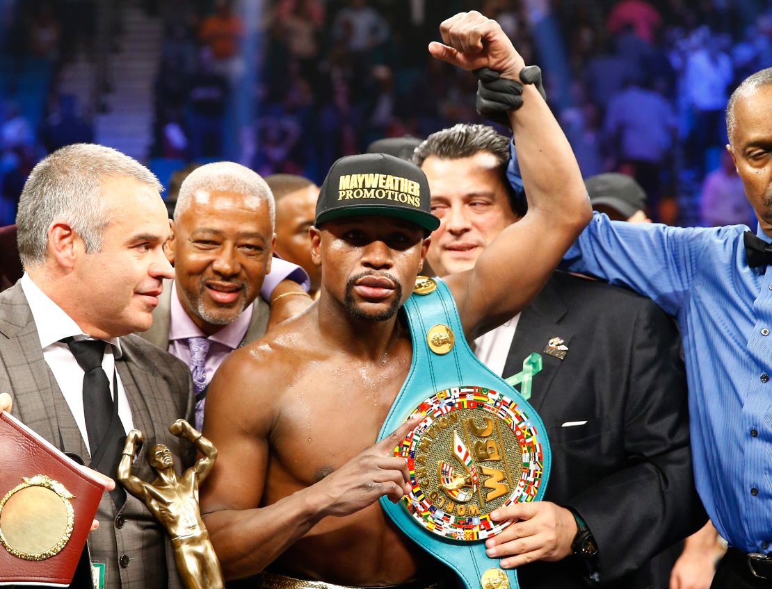 Floyd Mayweather Jr. celebrates victory after the MGM clash.