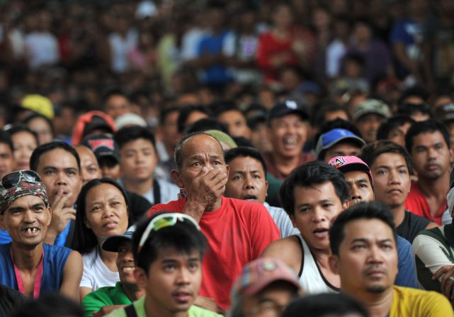 A fan reacts after Pacquiao loses to Mayweather in a battle that was billed the "Fight of the Century."