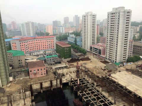 Rebar rises from a building under construction in Pyongyang, the capital city of North Korea, on Sunday, May 3.<br />