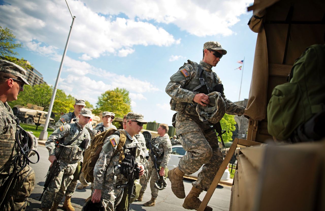 Members of the National Guard board a truck at an armory staging area on May 3 in Baltimore. After a night of relatively peaceful protests, <a href="http://www.cnn.com/2015/05/03/us/freddie-gray-baltimore-protests/index.html">the city lifted a curfew</a>, the National Guard is preparing its exit and a mall that had been a flashpoint in the protests has been reopened. 