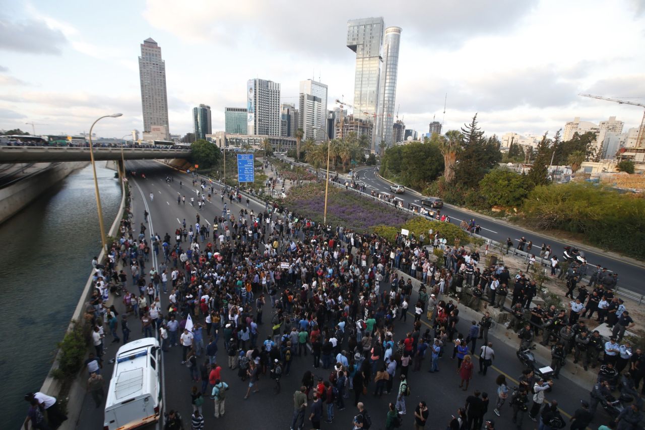 Protesters block the Ayalon freeway in Tel Aviv during the demonstration.