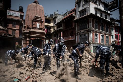 Nepalese police officers clear debris from Durbar Square in Kathmandu on Sunday, May 3. A magnitude-7.8 earthquake centered less than 50 miles from Kathmandu <a href="http://www.cnn.com/2015/04/28/asia/nepal-earthquake/index.html">rocked Nepal with devastating force</a> Saturday, April 25. The earthquake and its aftershocks have turned one of the world's most scenic regions into a panorama of devastation, killing and injuring thousands.
