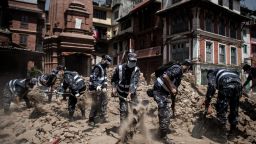 Members of the Nepalese police clear debris from Durbar Square in Kathmandu on Sunday, May 3.