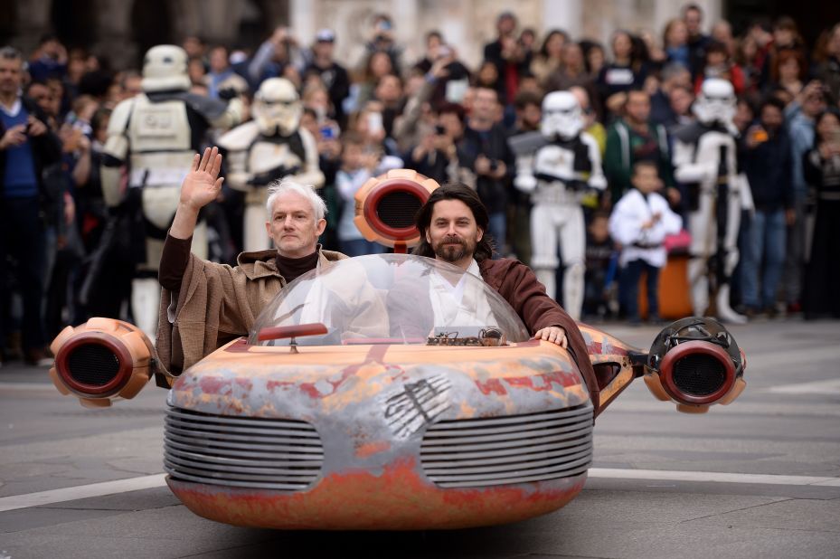 Cosplayers dressed as "Star Wars" characters Obi Wan Kenobi and Anakin Skywalker attend a "Star Wars" Day event in Milan, Italy, on May 3, as fans get a jump on celebrating "Star Wars Day." 