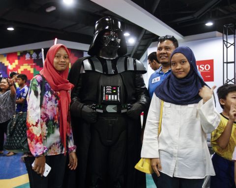 Malaysians pose for a souvenir photograph with Darth Vader in Kuala Lumpur, Malaysia, on May 2.