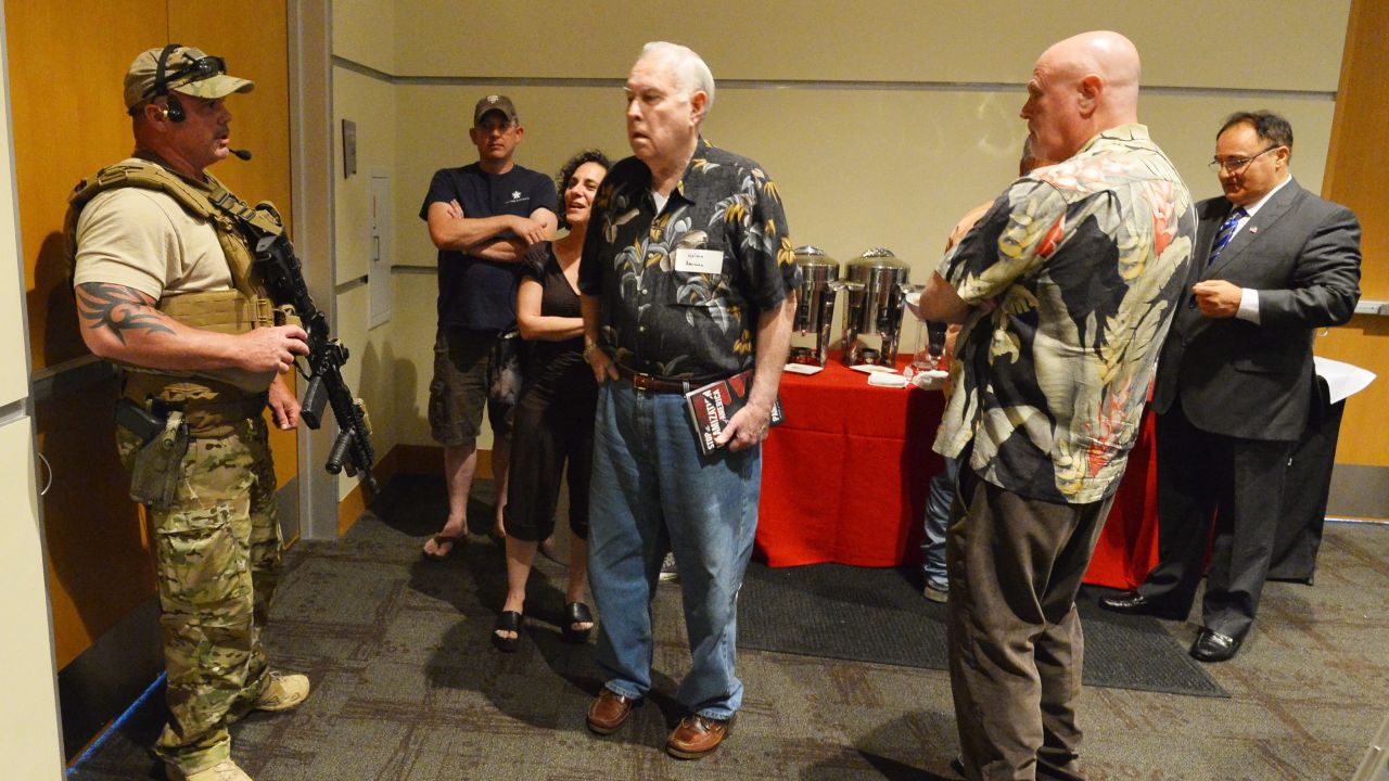 A Garland police officer keeps members of the audience inside the Curtis Culwell Center in Garland. 