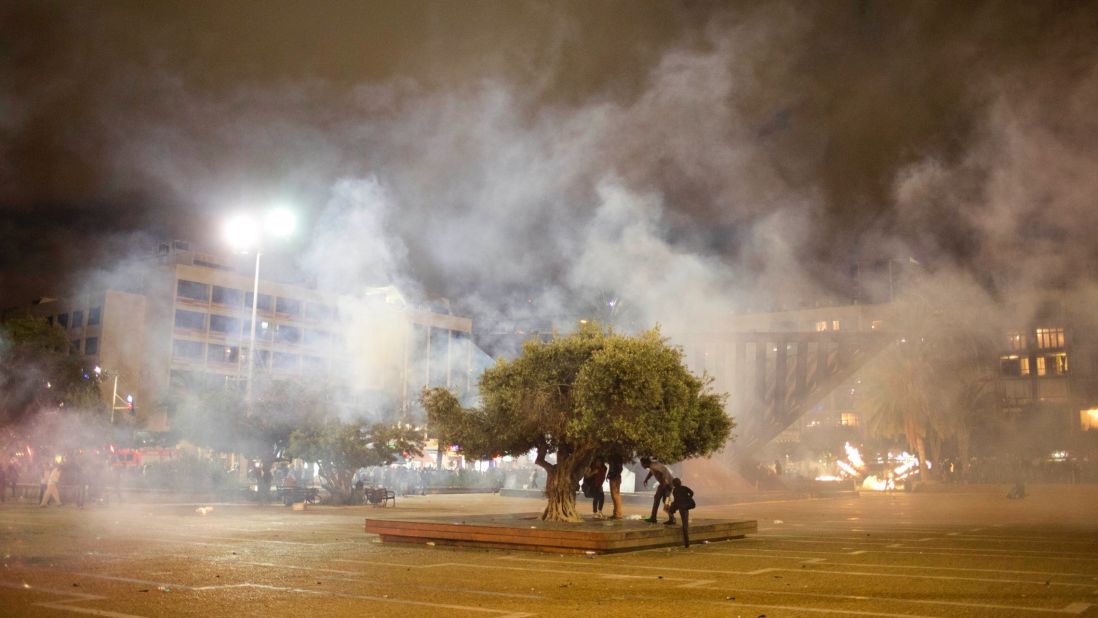 Protesters in Tel Aviv clash with Israeli riot police during the May 3 protest against racism and police brutality. The protest was mostly peaceful during the day, but it became violent by nightfall. At least 20 officers were hurt and "multiple protesters" were arrested, police spokesman Micky Rosenfeld said.