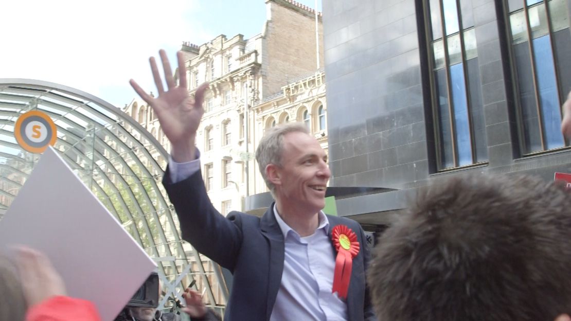 Jim Murphy waves to attendees at a rally on May 4, 2015, in Glasgow, Scotland.