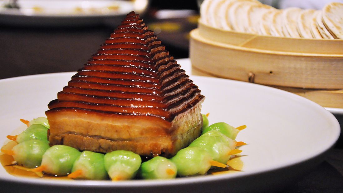 Often considered a rustic dish, Dongpo pork gets an upgrade in the city.<br />At 28 Hubin Road, each pig is used to produce just six portions of pork belly, which are frozen before being sliced into 26 layers (in one continuous spiral cut). The meat is steamed for three hours, melting the fat and leaving the pork moist but not greasy. Smoked bamboo shoots are stuffed underneath, creating a pork pyramid. Diners sandwich a thin layer of pork and some bamboo shoots in a chestnut pancake.