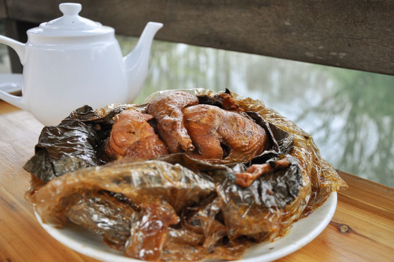 The chicken itself is stuffed with pork and mushrooms, wrapped in lotus leaf and baked in clay.