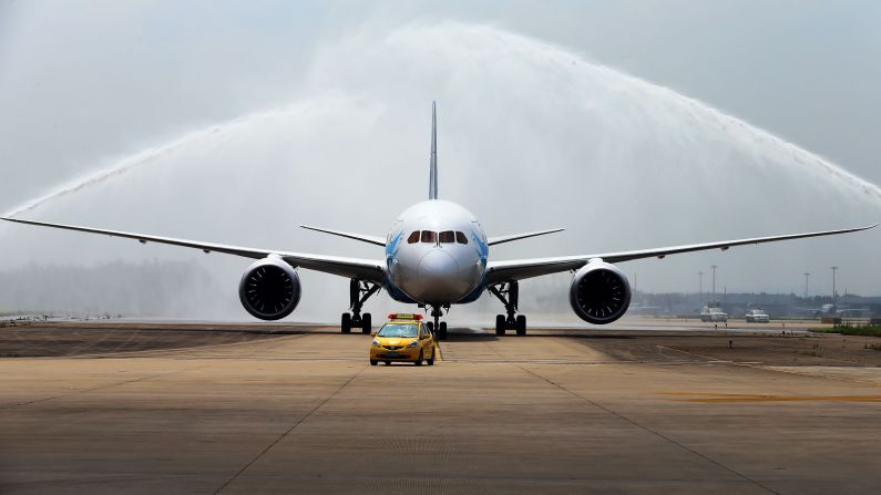 China's first Boeing 787 Dreamliner delivered to China Southern Airlines receives a ceremonial water salute upon arrival at the airport in Guangzhou, in southern China's Guangdong province, on June 2, 2013.