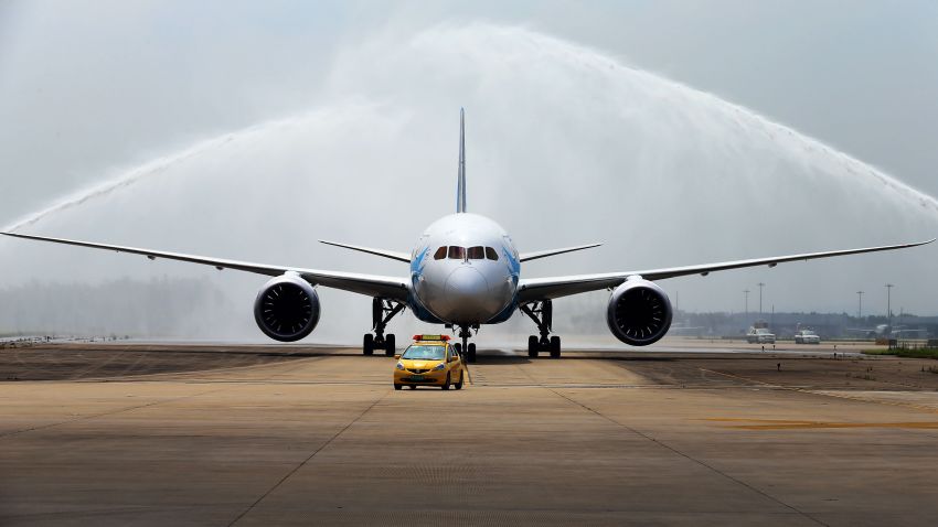 China's first Boeing 787 Dreamliner delivered to China Southern Airlines receives a ceremonial water salute upon arrival at the airport in Guangzhou, southern China's Guangdong province on June 2, 2013. China's first Boeing 787 arrived in the country on June 2, state-run media said, less than two weeks after Beijing regulators approved the aircraft, which had faced safety problems.   CHINA OUT      AFP PHOTO        (Photo credit should read STR/AFP/Getty Images)