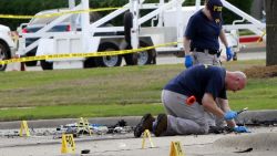 Investigators work a crime scene before the removal a two bodies outside of the Curtis Culwell Center after a shooting occurred the day before May 04, 2015 in Garland, Texas. During the "Muhammad Art Exhibit and Cartoon Contest, " an anti-Islam event, on May 03, Elton Simpson of Phoenix, Arizonia and another man opend fire, wounding a security guard . Police officers shot and killed Simpson at the scene.