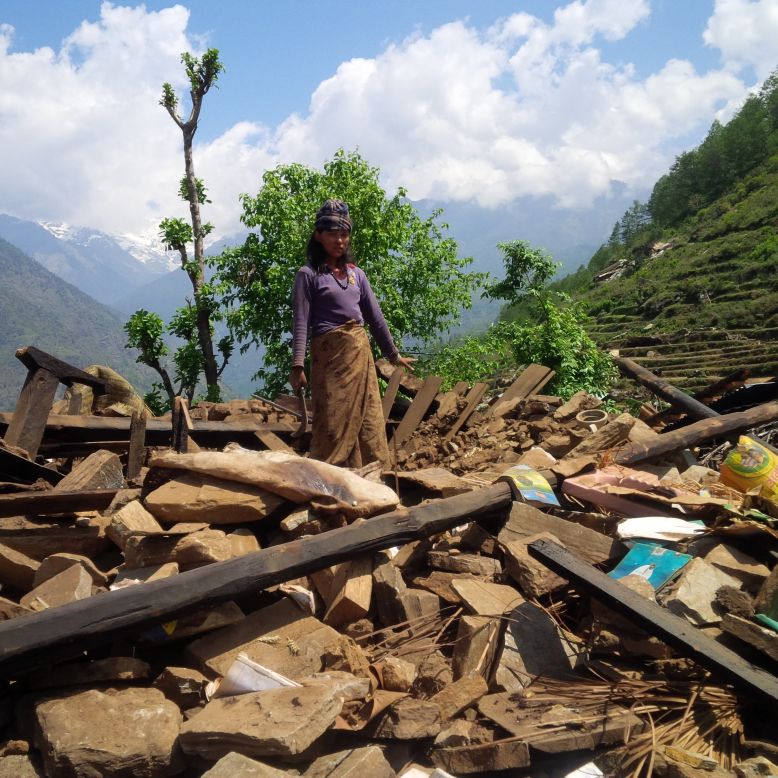 While most villagers have gone down to safer plains, a few remain in the collapsed village of Mandre.