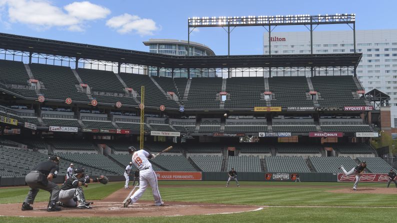 Orioles first baseman Chris Davis hits a three-run home run in the bottom of the first inning to an empty Oriole Park in Baltimore, on Wednesday, April 29. <a href="index.php?page=&url=http%3A%2F%2Fwww.cnn.com%2F2015%2F04%2F29%2Fus%2Fgallery%2Fwhite-sox-orioles-baseball%2Findex.html">The baseball game</a> was played in a stadium closed to the public after the <a href="index.php?page=&url=http%3A%2F%2Fwww.cnn.com%2F2015%2F04%2F23%2Fus%2Fgallery%2Ffreddie-gray-protest%2Findex.html">protests in the city turned to riots</a> last week.