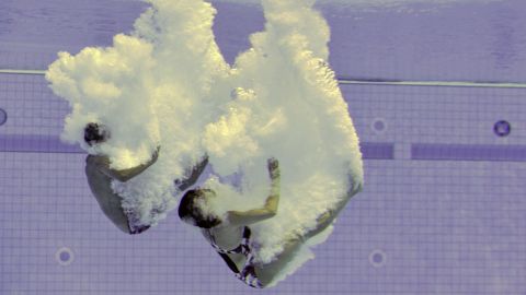 Two competitors dive during the 10 meter platform mixed final on Sunday, May 3, during the FINA/NVC Diving World in London.