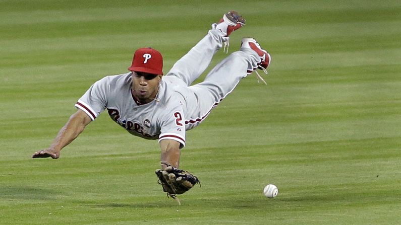 Philadelphia Phillies center fielder Ben Revere misses a ball hit by Miami Marlins' Marcell Ozuna during the fourth inning on Sunday, May 3, in Miami.