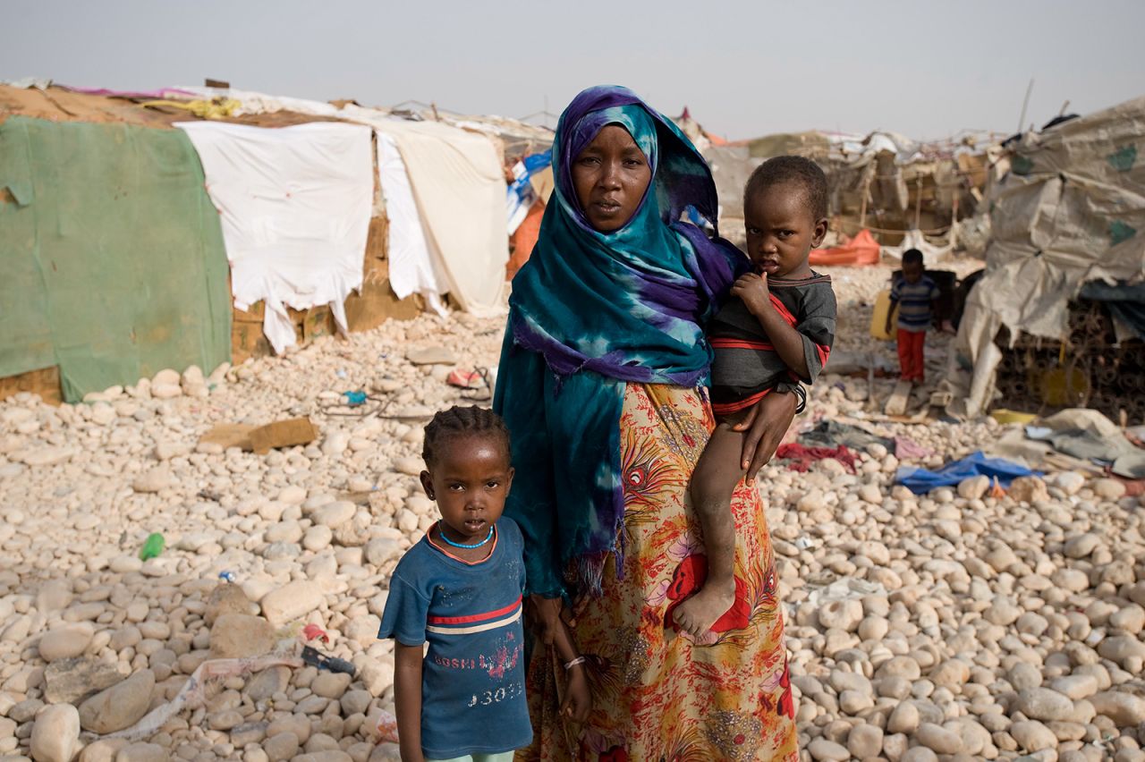 <strong>179.</strong> Racked by poverty and political strife, <strong>Somalia</strong> is at the bottom of the Save the Children list. Asmara is shown with two of her three children in one of the internally displaced people camps in Bosaso, Puntland. She traveled 10 days and nights to reach the camp, selling everything to escape her drought-ridden home. She still couldn't afford to bring one of her daughters with her. 