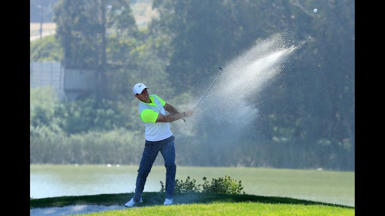 Northern Ireland's Rory McIlroy hits from a bunker on the 12th hole on Thursday, April 30, during the World Golf Championship Cadillac Match in San Francisco.