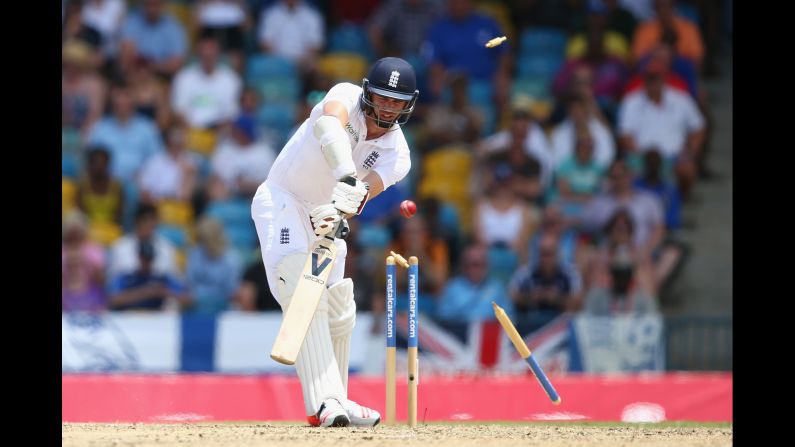 James Anderson of England is bowled by Jerome Taylor of West Indies during a cricket match on Saturday, May 2, in Bridgetown, Barbados.