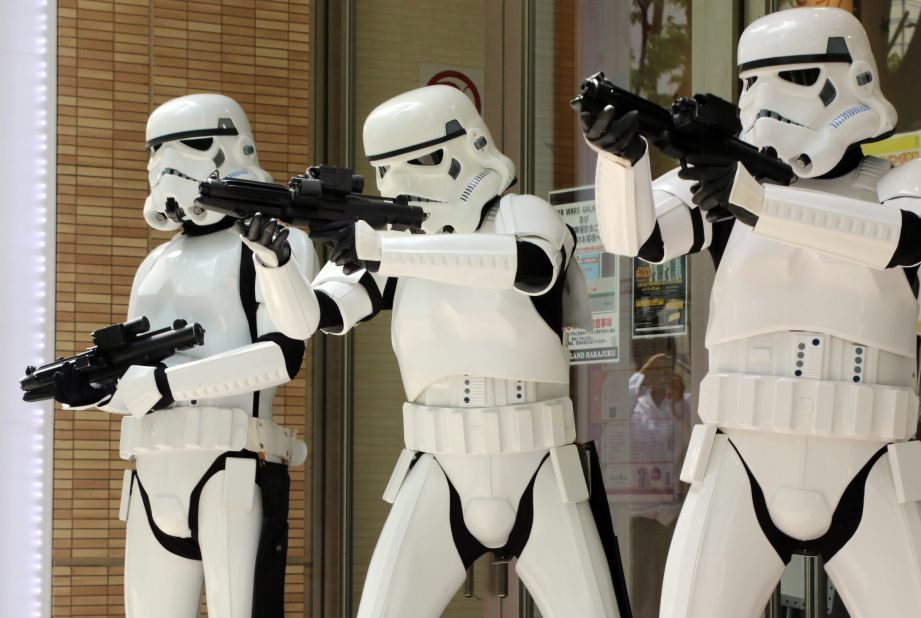 People pose as Stormtroopers at a toy shop to promote "Star Wars" goods in Tokyo on May 4. May 4 is called "Star Wars Day" by fans of the film series, because the famous phrase "May the Force be with you" in the movies sounds like "May the 4th be with you."