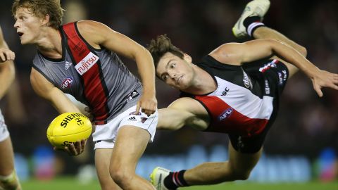 St. Kilda Saints player Dylan Roberton tackles Martin Gleeson of the Essendon Bombers during an Australian rules football match on Sunday, May 3, in Melbourne.