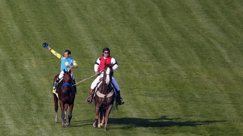 Jockey Victor Espinoza celebrates after riding American Pharaoh to victory in the Kentucky Derby horse race on Saturday, May 2, in Louisville, Kentucky.