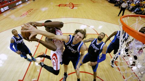 Dallas Mavericks forward Dirk Nowitzki defends against Clint Capela of the Houston Rockets on Tuesday, April 28, during the 2015 NBA Playoffs in Houston.