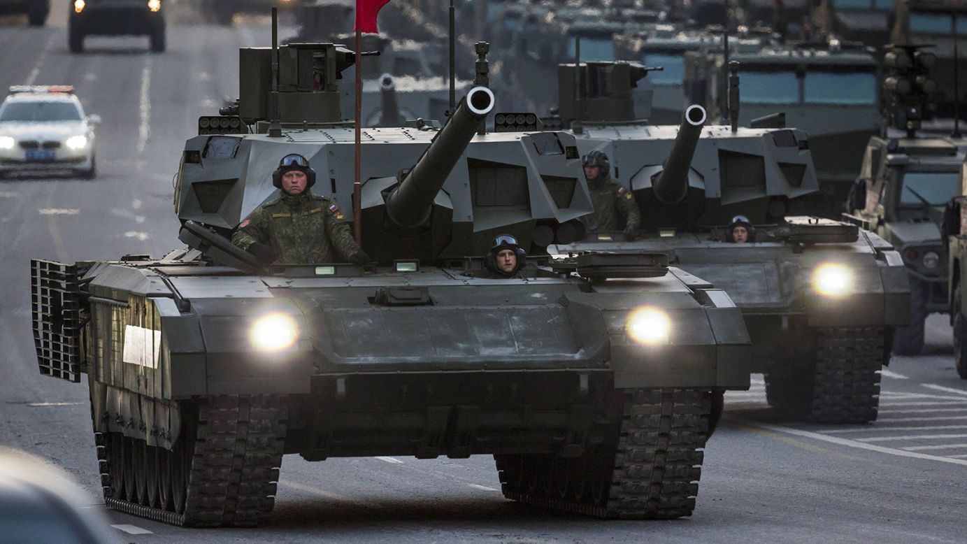 New Russian military vehicles including the new Russian T-14 Armata tank, foreground, make their way to Red Square on Monday during a rehearsal for the Victory Day military parade.