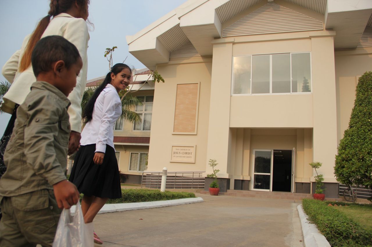 Parishioners arrive at the North Phnom Penh Stake Center of the Church of Jesus Christ of Latter-day Saints for Sunday services. Cambodia's Mormon population has grown from just a handful of members a decade ago to more than 12,000 today.