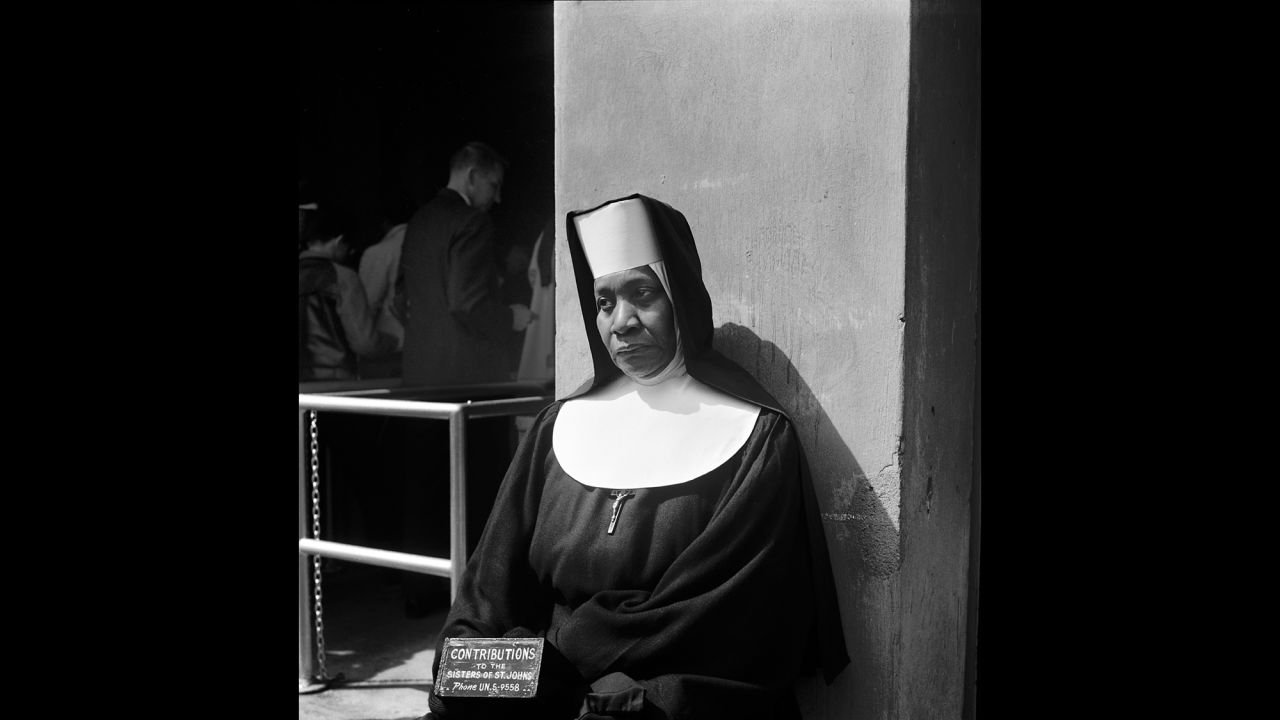 A nun collects donations on Coney Island in 1959.