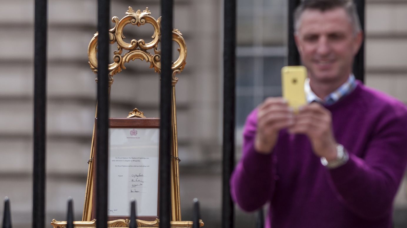 A man takes a selfie in front of the royal birth announcement of the Duke and Duchess of Cambridge's second child, <a href="http://www.cnn.com/2015/05/02/world/gallery/royal-baby-princess-announced/index.html">Princess Charlotte of Cambridge</a>, born on Saturday, May 2. 