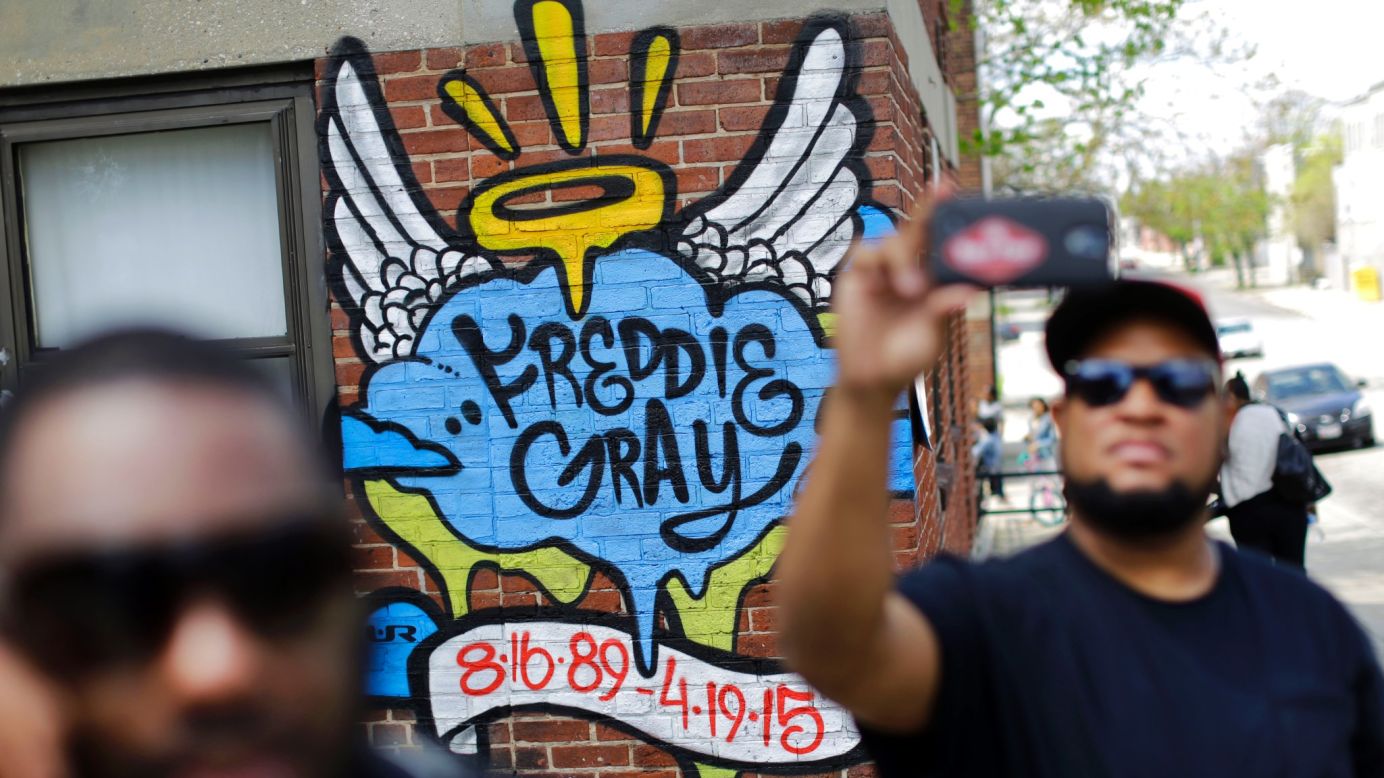 A man takes a selfie on Saturday, May 2, in front of a mural that was painted at the site of Freddie Gray's arrest in Baltimore, as people prepare to march to City Hall. The death of Grey in police custody <a href="http://www.cnn.com/2015/04/23/us/gallery/freddie-gray-protest/index.html">sparked protests in Baltimore</a> and <a href="http://www.cnn.com/2015/04/30/us/gallery/freddie-gray-protests-across-us/index.html">across the country</a>. Six police officers were charged May 1 with felonies in connection to his death. 