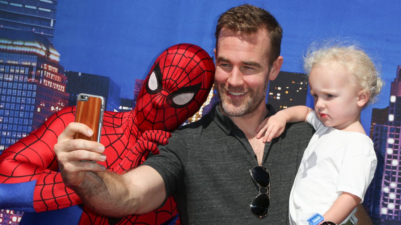 Actor James Van Der Beek and his son Joshua take a photo with the Spiderman character at the premiere of "Marvel Universe LIVE!" in Inglewood, California, on Saturday, May 2.