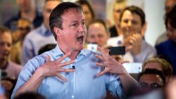 HENDON, ENGLAND - MAY 05: Prime Minister David Cameron speaks to staff at Utility Warehouse on May 5, 2015 in Hendon, England. Campaigning has intensified in the last few days before voters go to the polls in a general election on May 7, 2015. (Photo by Rob Stothard/Getty Images)