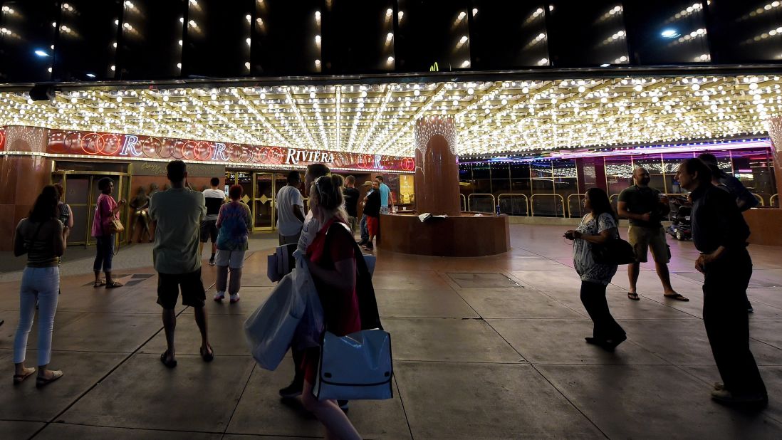 People stand outside of the Riviera on May 3. The hotel-casino now joins the Dunes, the Sands, the Sahara, the Aladdin and other departed resorts from a bygone Strip era. <a href="http://www.cnn.com/2015/05/01/opinions/gallery/riviera-las-vegas/index.html">See more photos from the casino's 60-year history.</a>