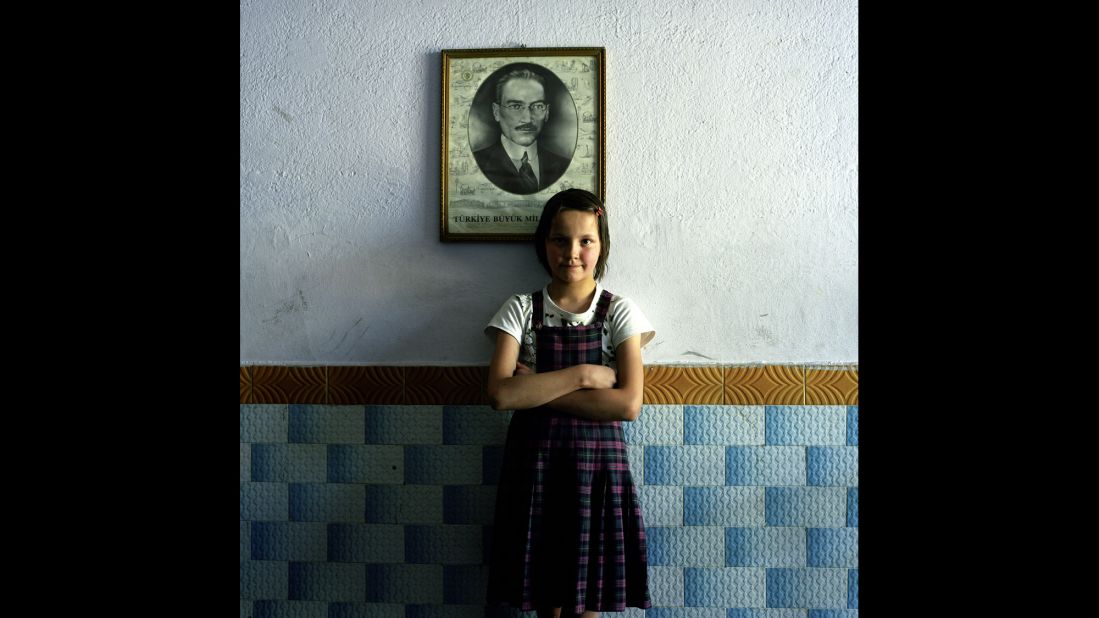 A student in an elementary school stands in front of a photo of Ataturk in Kutahya, central Turkey.