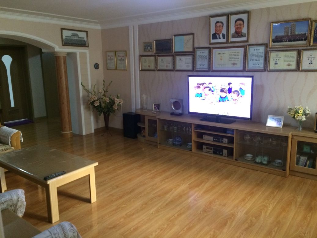 The apartment has modern electronics including a new flat screen television.